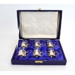 A cased set of six silver mounted liqueur glasses, each decorated with floral sprays,
