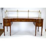 A Sheraton Period mahogany concave sideboard, c.