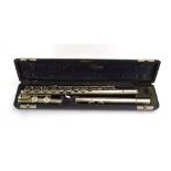 A cased German flute,