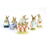 Six Royal Albert Beatrix Potter figures: Mrs Flopsy Bunny, Mrs Rabbit cooking, Mrs Rabbit & Bunnies,