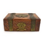 A Victorian oak jewellery box with brass 'strap' bindings in the form of a trunk, w.