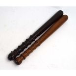 Two 19th century turned mahogany and beech truncheons