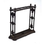 A Victorian black cast metal umbrella and stick stand in the manner of Coalbrookdale