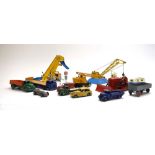 A mixed group of loose Dinky diecast including a Foden low loader, an excavator loader,