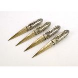 A set of four novelty silver sweetcorn skewers, each in the form of a corn on the cob,