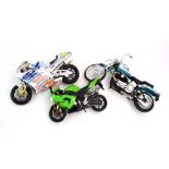 A small group of plastic motorcycle models