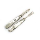 An Edwardian silver and mother of pearl mounted travelling knife and fork set with folding blades