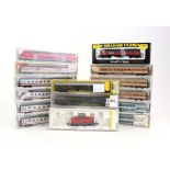 Fourteen Fleischmann and other N gauge coaches, together with a Trix diesel shunter,