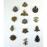A group of thirteen County and City volunteer regiment cap badges including Kent, Bedfordshire,