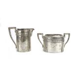 An Austrian metalware two handled sugar bowl of Neo-Classical design, and a matching cream jug,
