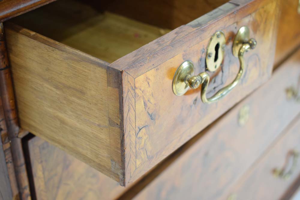 A Georgian walnut and feather crossbanded chest of three short over three long drawers on later bun - Image 5 of 27