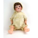 An Armand Marseille bisque headed doll with sleeping blue glass eyes,
