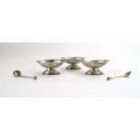 A set of three Edwardian silver salts of oval form on raised feet, maker JMB, Chester 1902,