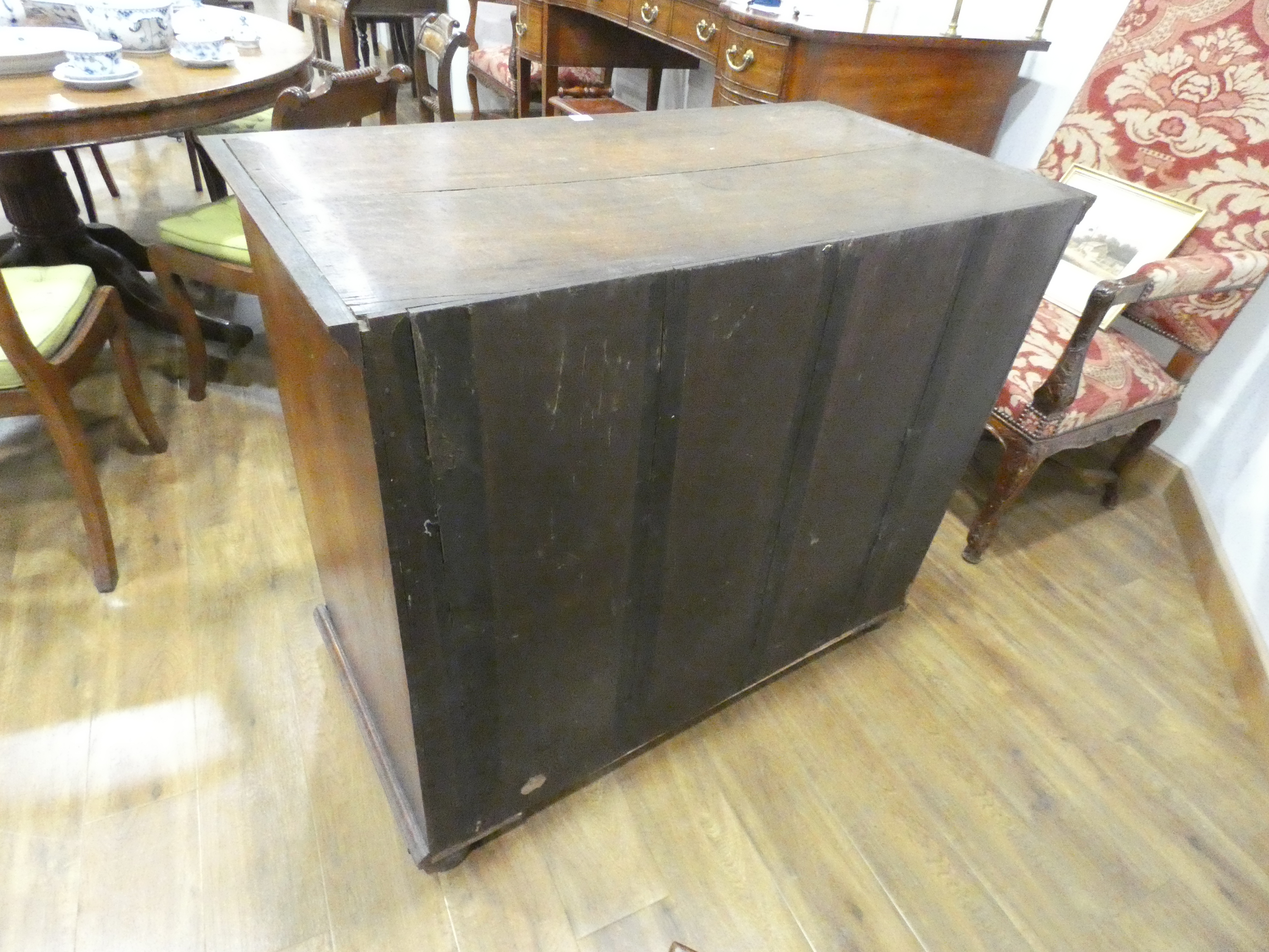 A Georgian walnut and feather crossbanded chest of three short over three long drawers on later bun - Image 21 of 27