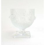 A Lalique glass vase of ovoid form decorated with a band of stylised birds within a leafy ground on