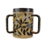 A Doulton Lambeth stoneware three handled loving mug of cylindrical form,