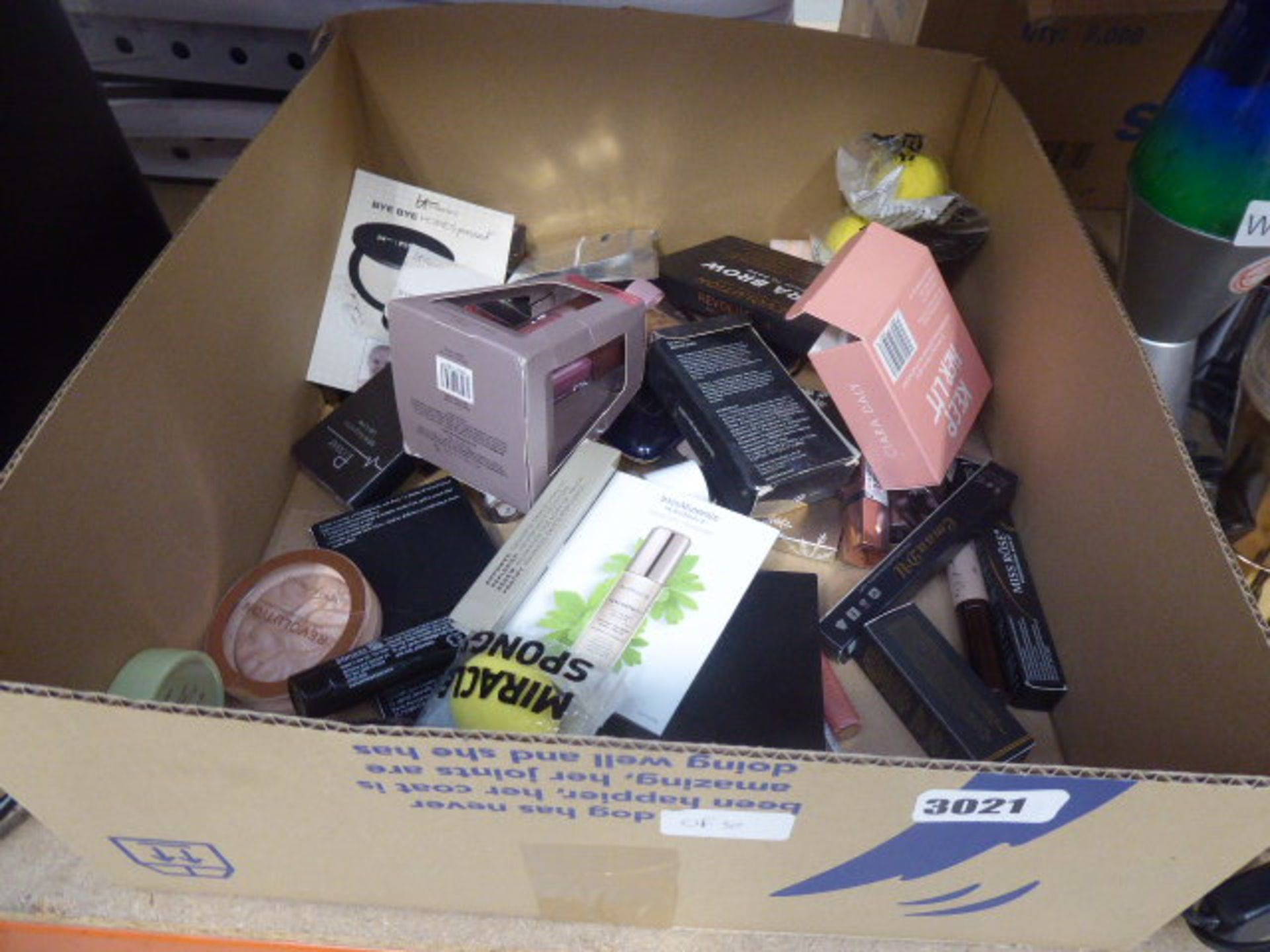 3020 - Box containing various cosmetics and make up including revolution, bare minerals etc.