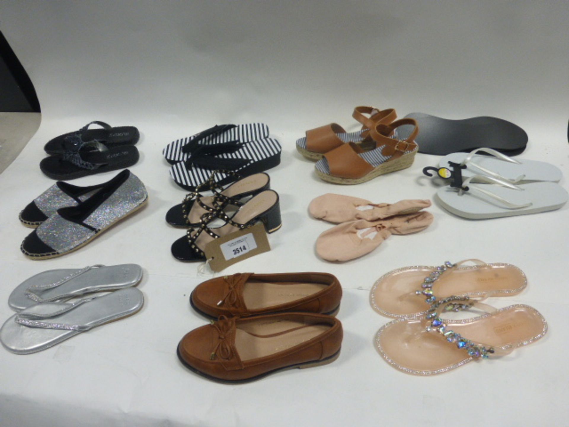 Bag of assorted ladies shoes and footwear accessories