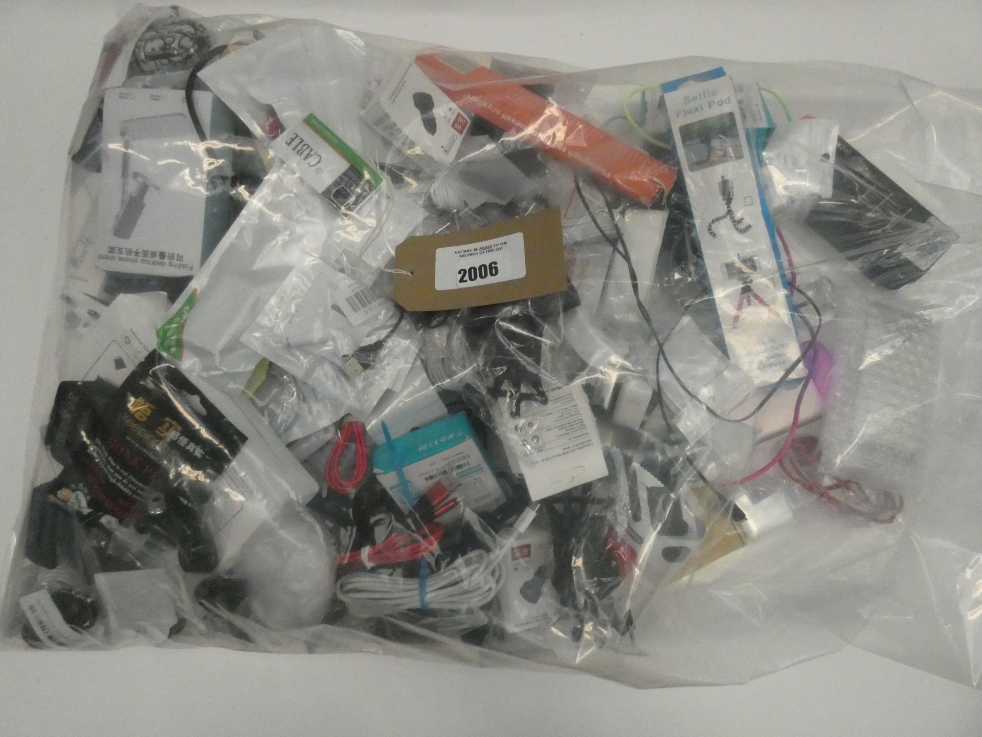 Bag containing quantity of various mobile phone accessories; cables, leads, adapters, earphones,