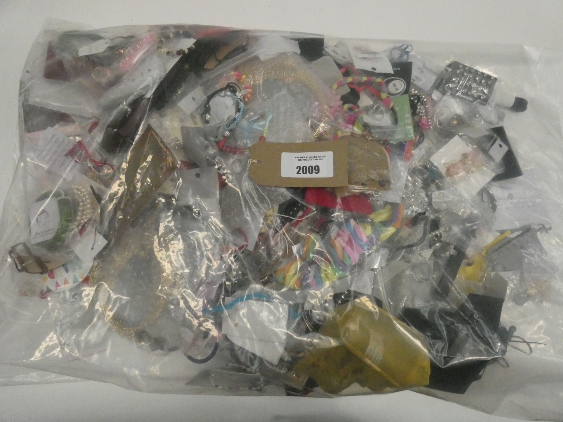 Bag containing quantity of loose costume and dress jewellery