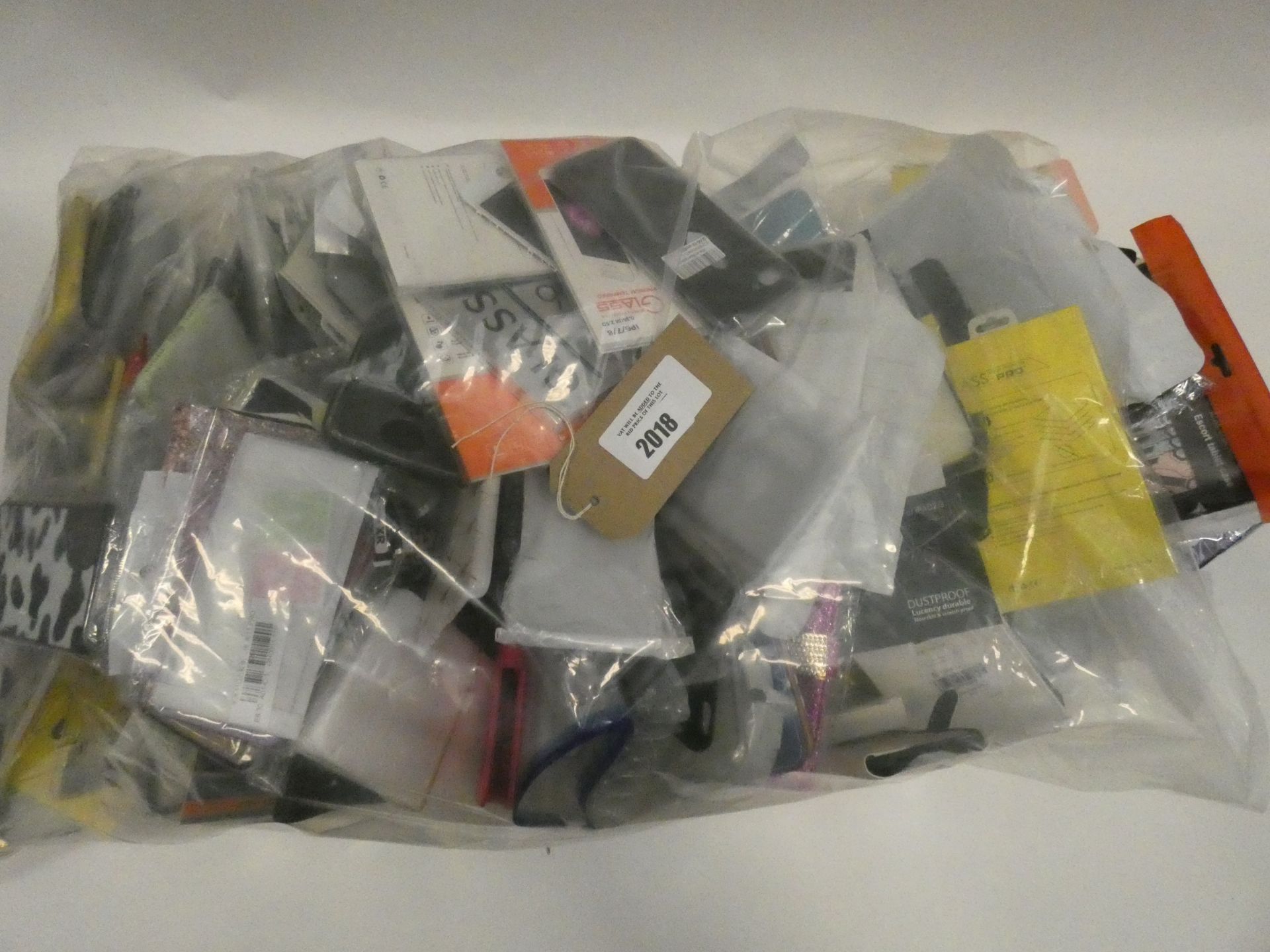 Bag containing quantity of various mobile phone cases and covers
