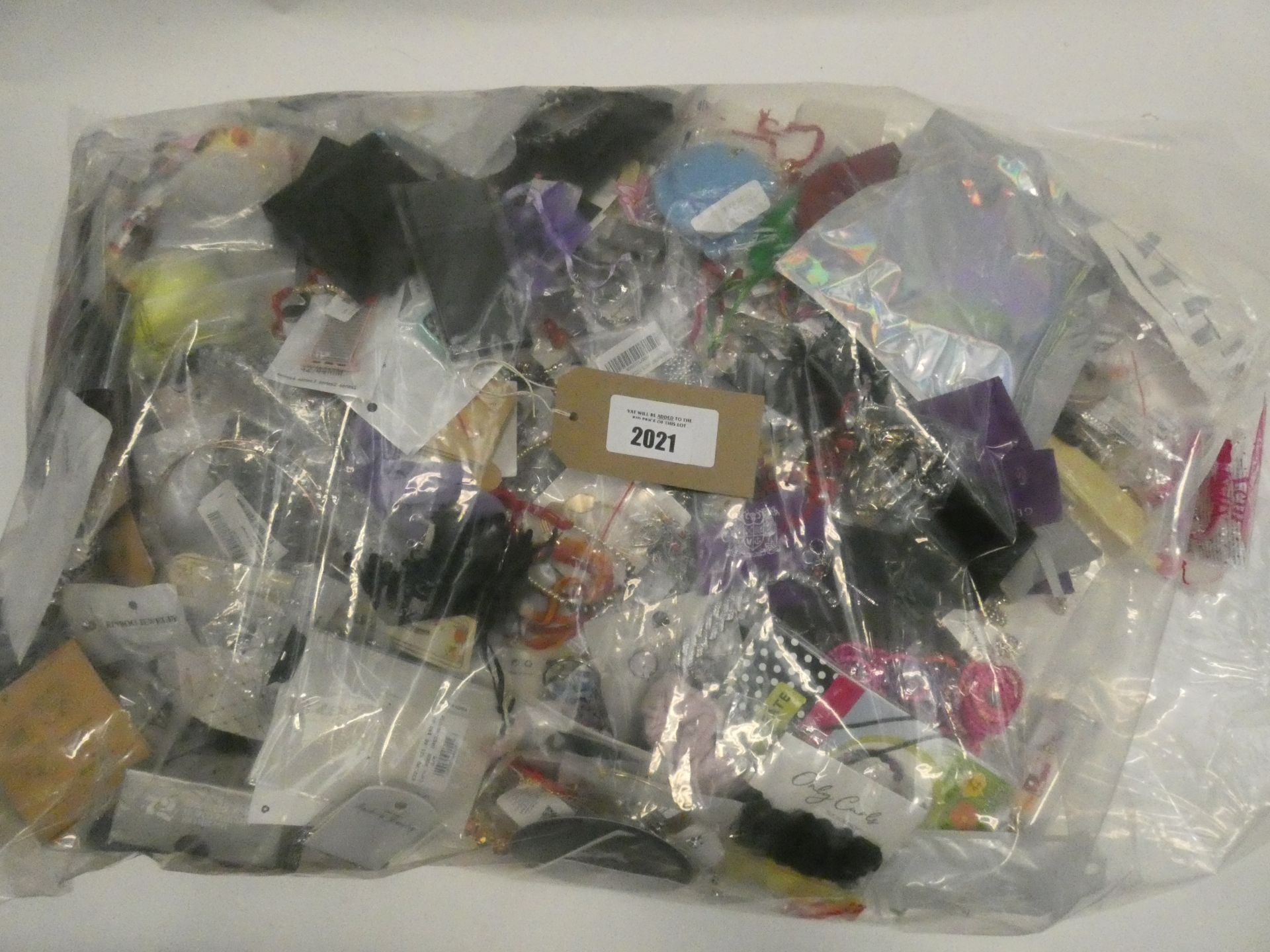 Bag containing quantity of loose costume and dress jewellery