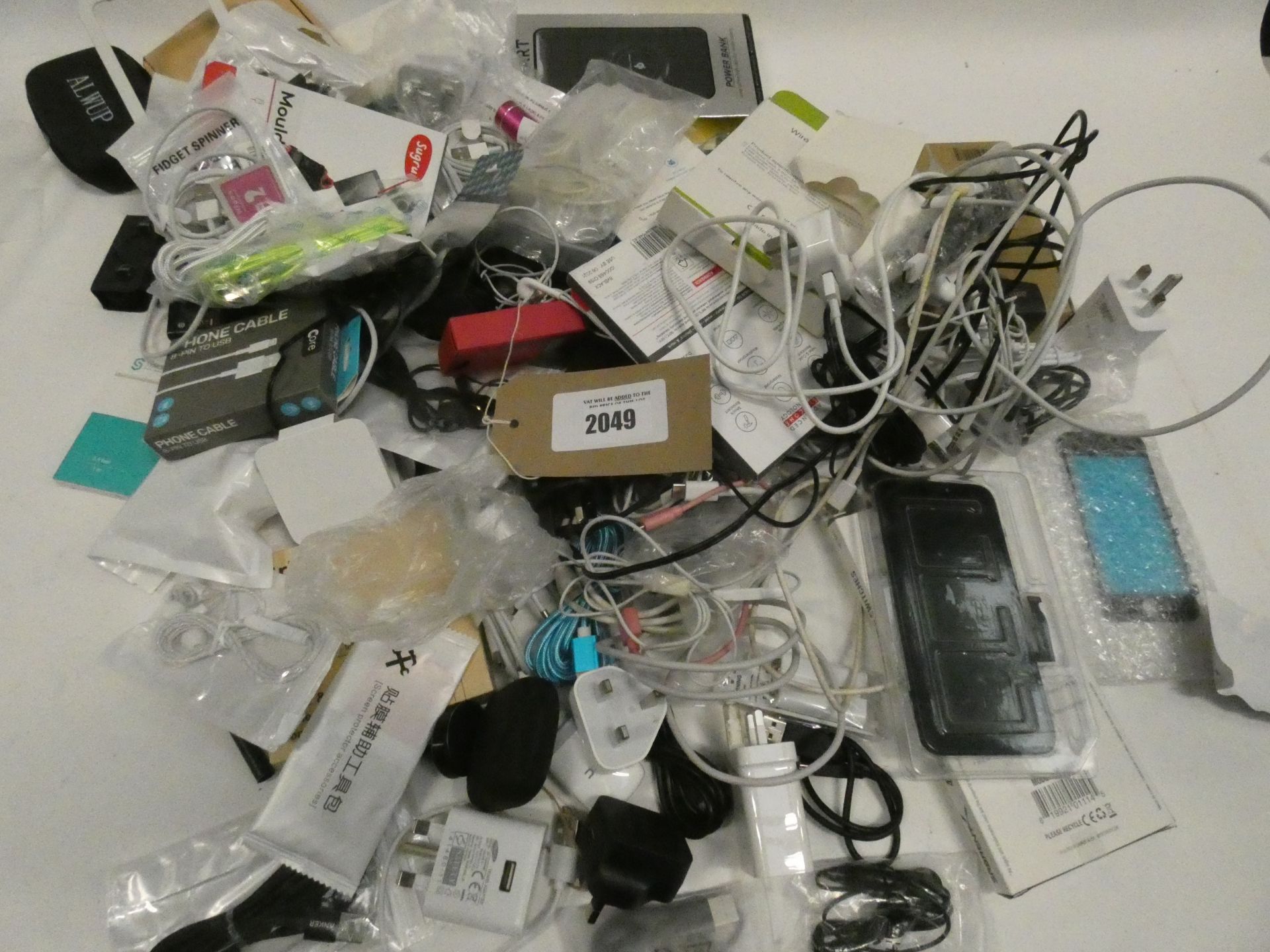 Bag containing quantity of various mobile phone accessories; cables, earphones, power banks,