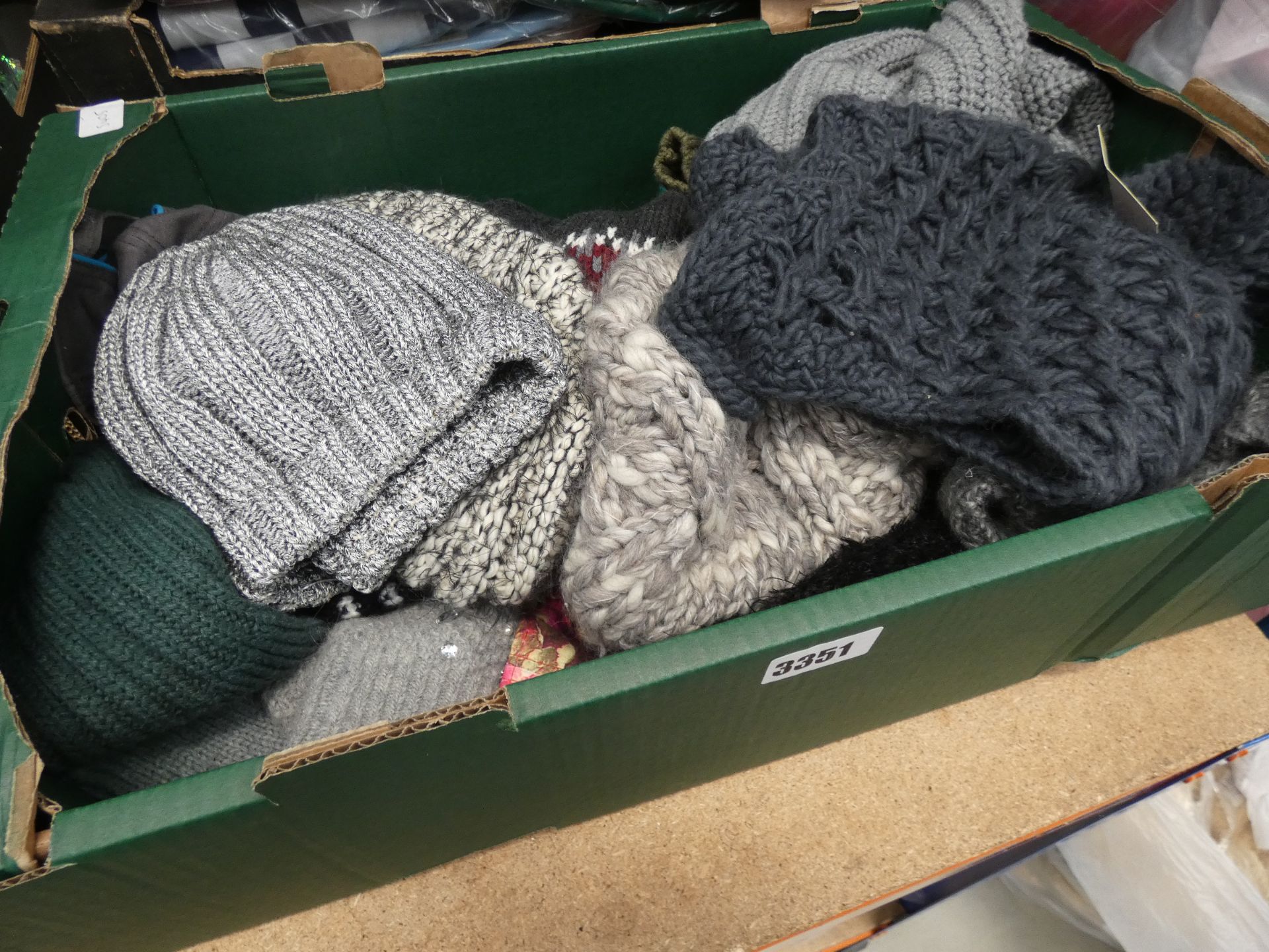Tray containing mixed wooly hats