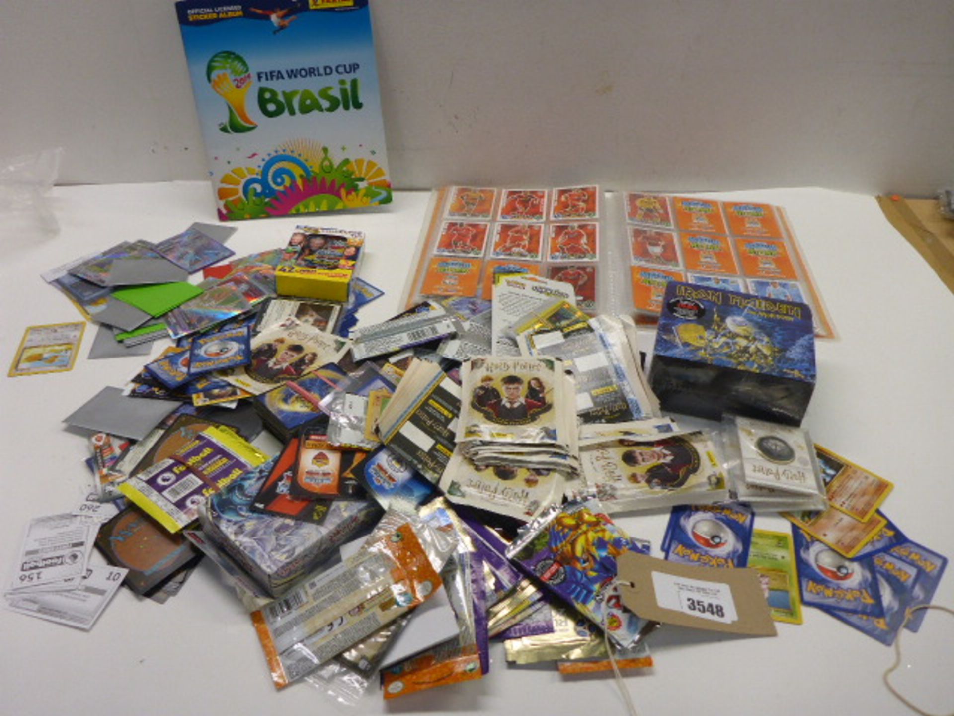 Large quantity of collectable trading cards including Pokemon, Match Attach, Fifa World Cup, Harry