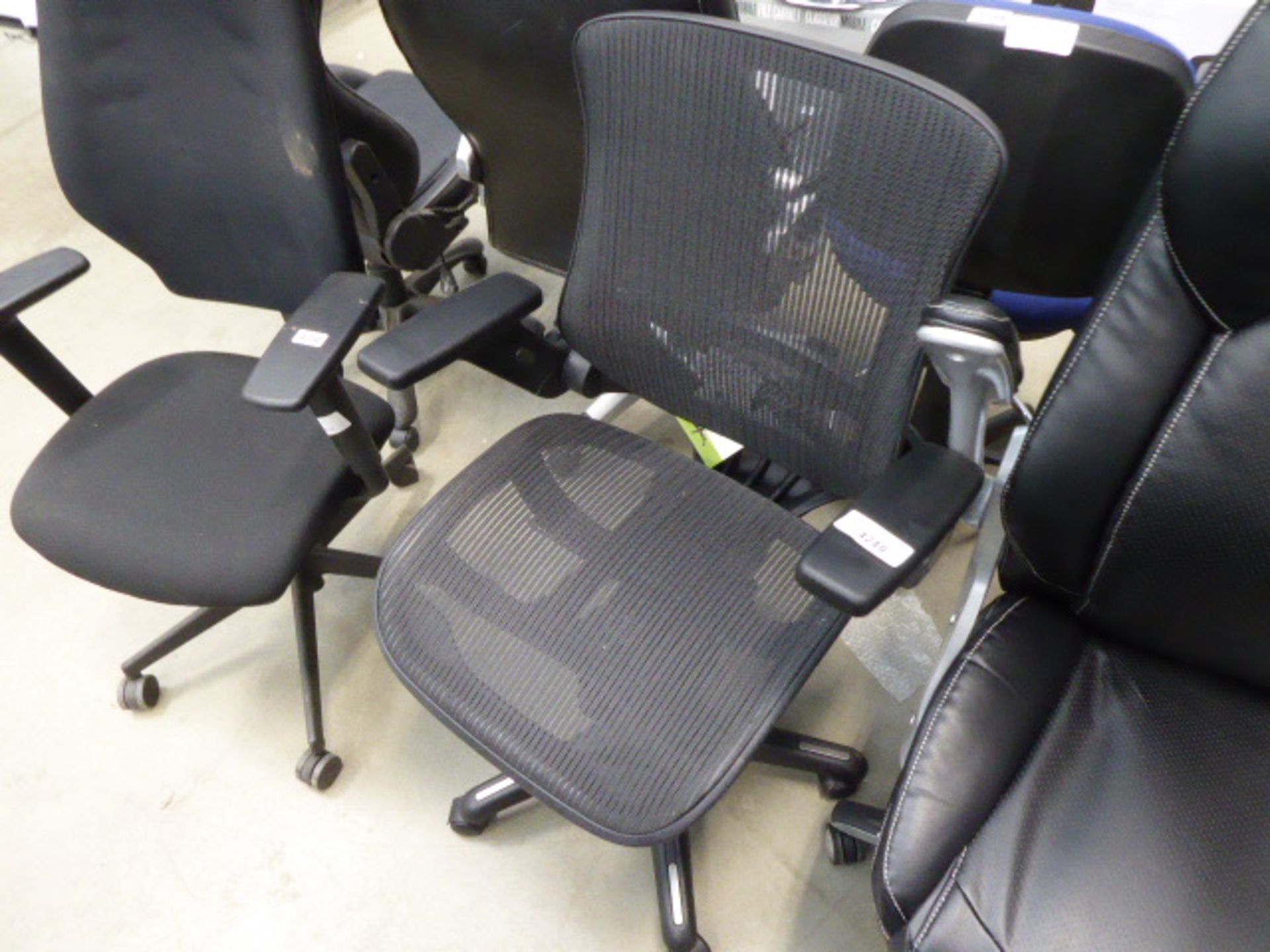 High backed office swivel armchair in black mesh on black base