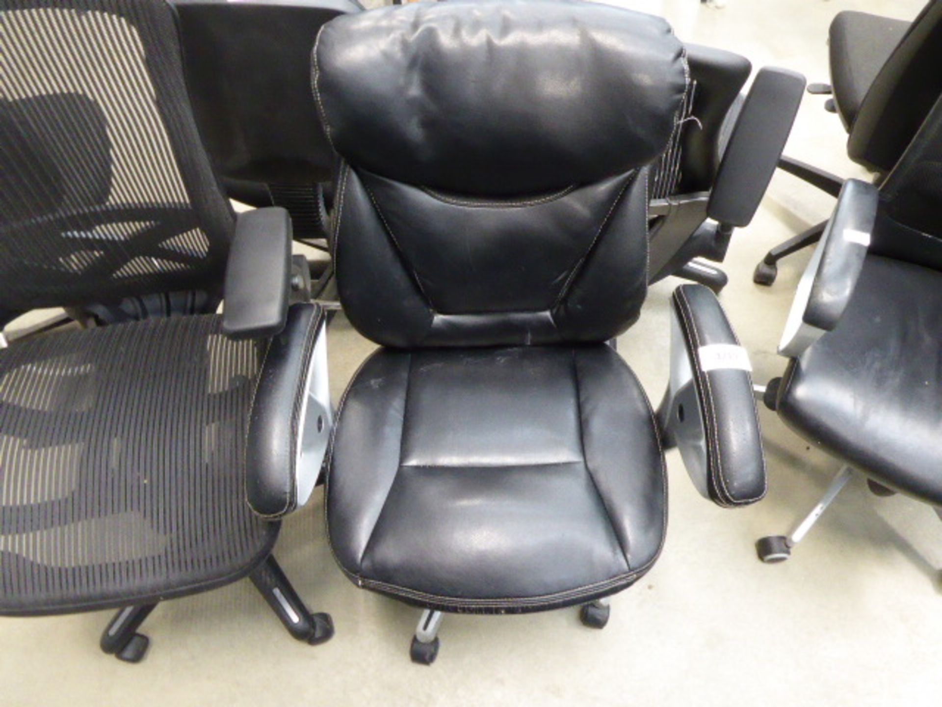 High backed office swivel armchair in black on chrome base