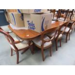 Reproduction extending dining table with 8 chairs to include 2 carvers