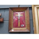 A wall hanging with a crucifix