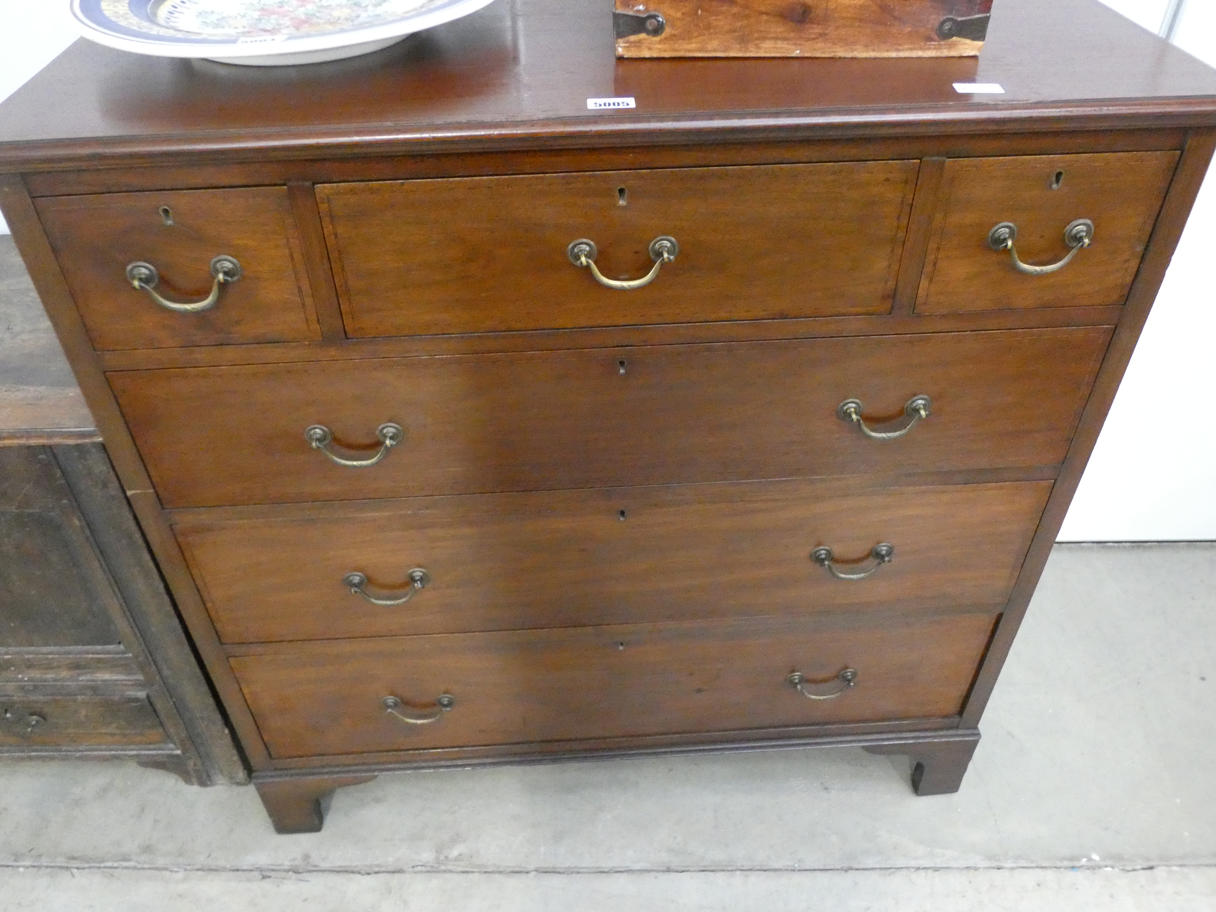 3 over 3 mahogany chest of drawers on bracket feet