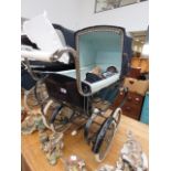 Silver Cross pram with a quantity of dolls