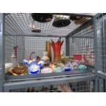 Cage containing paperweights, coloured glass vases and bowls