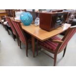 Teak extending dining table plus six chairs to include two carvers
