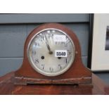 An oak domed mantel clock