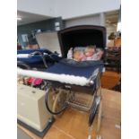 Silver Cross pram with a quantity of dolls