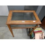 Glass topped display table in mahogany