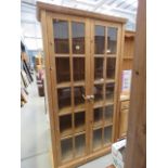 Glazed pine double door bookcase