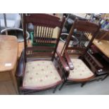 Pair of upholstered armchairs with carved frames