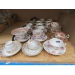 A quantity of floral patterned cups & saucers