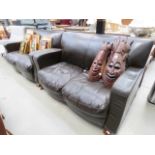 Pair of brown leather effect two seater sofas