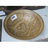 (2040RR) 393 - A studio pottery dish of circular form, slip decorated in shades of brown,