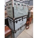 3 grey painted travelling trunks