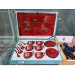 Japanese red lacquered tea service with cups, saucers, spoons and tray
