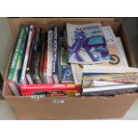 A box containing motorcycle reference books