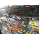 Shelf of vanguard diecast toys together with other boxed diecast cars