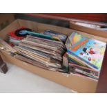 A box containing a large quantity of Beano annuals, plus children's books and vinyl records